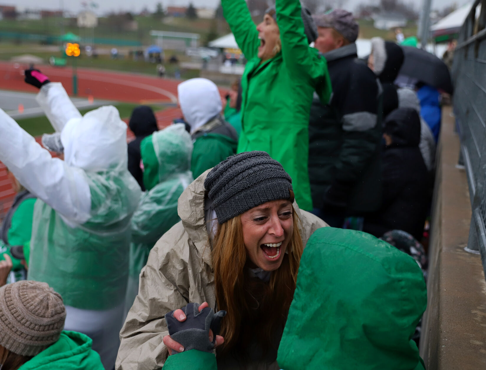 Brandy Prenger, left, and Judy Robinson cheer for the Falcons